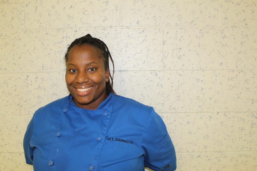 Culinary+Teacher+Khadijah+Muhammad+Kebe%2C+better+known+to+her+students+as+Chef%2C+poses+for+a+photo+outside+of+her+classroom+in+G-hall.+Chef+joined+the+WTHS+staff+at+the+start+of+the+2019-2020+school+year.